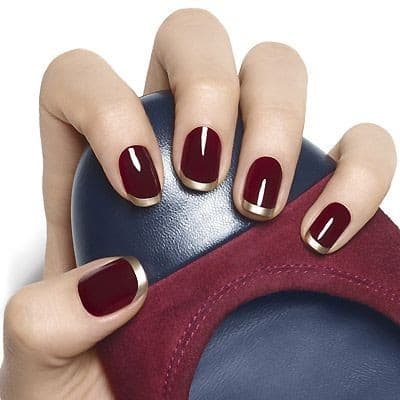 ricostruzione in gel rosso bordeaux e oro